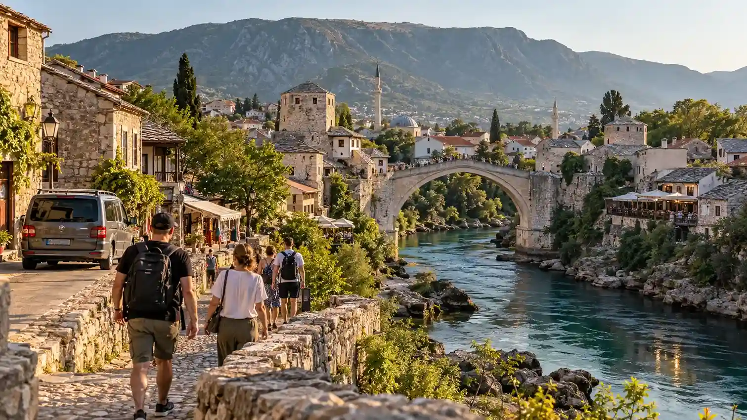 Travelers arriving in Mostar with Stari Most and the Neretva River in the background